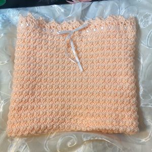 NWT hand crocheted stroller/bassinet blanket. Peach/white ribbon.